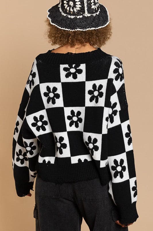 Our most popular style, this oversized sweater top is crafted with a round neckline and long sleeves for easy layering. A unique flower and checkerboard pattern creates an eye catching look. Ribbed edges add graphic detail and make it easy to pair with your favorite jeans or leggings. The irresistible oversized fit will never go out of style! Avah Couture