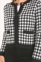 A classic piece that has timeless style, the Black And White Check Jacket is a must have this season. The heavy weight knit fabric features a black and white check pattern that gives it its name. A perfect balance of comfort and style, this jacket features 4 front snap buttons and 2 functional pockets. Wear it with your favorite outfit to work or play a classic piece to get you through any occasion! Avah Couture