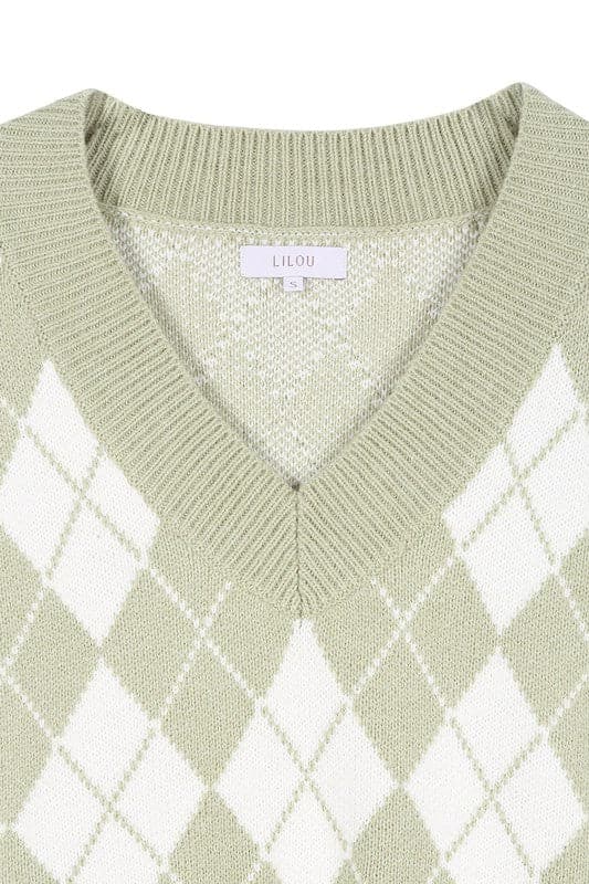 A knitted vest is a must have for fall and winter, and this version features an argyle pattern and V neckline to add some interest. It's sleeveless so you can wear it alone or layered over a button down shirt or tank. Green color. Avah Couture