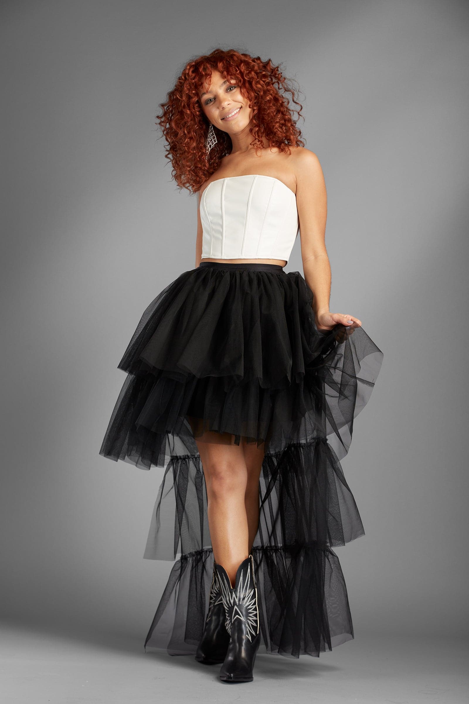 Take your look to the next level with the Berlyn black ruffle tulle skirt. The ultimate in trend and style, this skirt is as fun as it is sexy, and it will give your look an edge that is sure to turn heads - Avah Couture