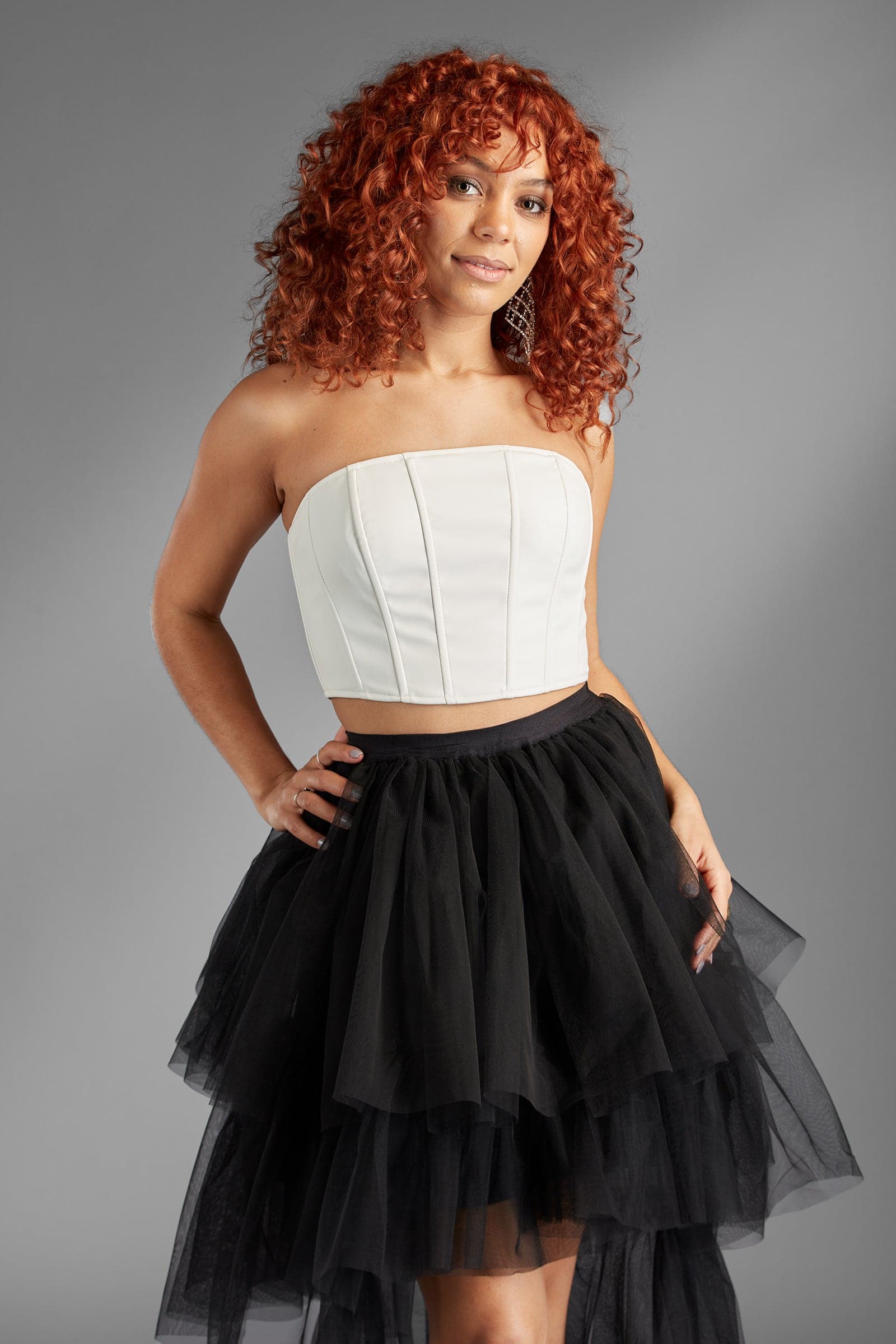 Take your look to the next level with the Berlyn black ruffle tulle skirt. The ultimate in trend and style, this skirt is as fun as it is sexy, and it will give your look an edge that is sure to turn heads - Avah Couture