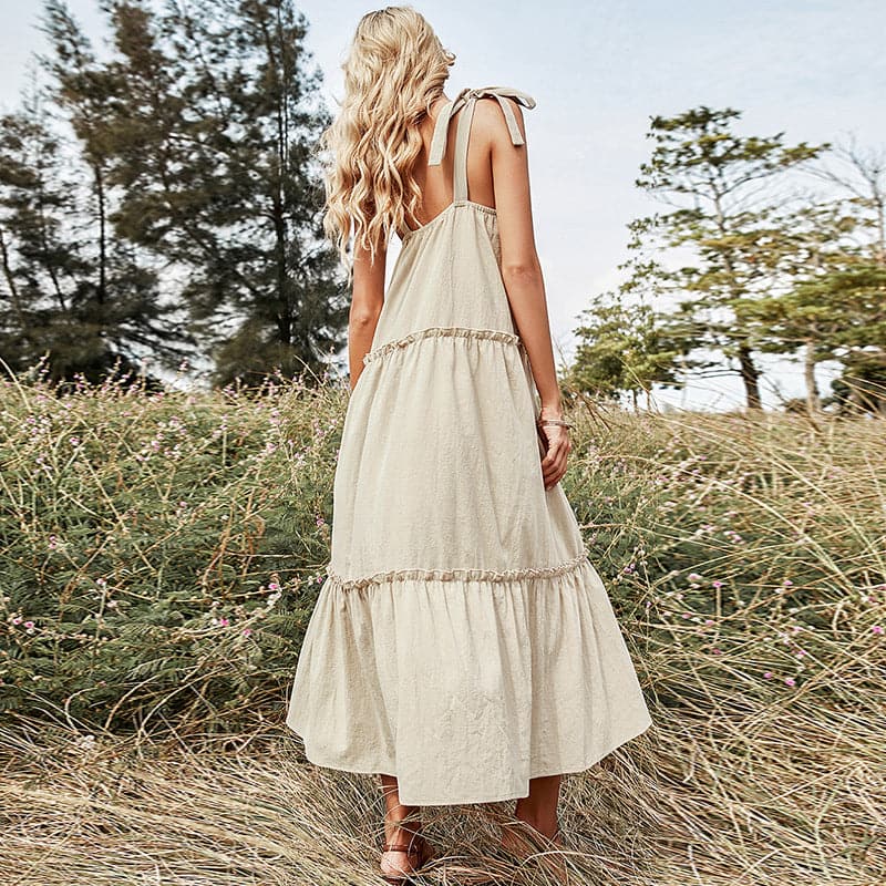 Avah Couture - This sundress is the perfect choice for a spring or summer day. The front tie leads to a sweet bow at the neckline, while the shoulder ties add some adorable detail. Made with 100% cotton and featuring a relaxed fit, this piece will have you looking casual yet chic in no time.