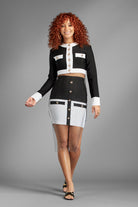 Feel like a queen in sheer elegance with the Revealed for Glory Two-Piece skirt suit. (Metal Mesh Rhinestone Overlay Sold Separately)  You'll look regal in this white and black bandage top jacket and mini skirt. In addition to being a fierce fashion statement, the thick stretch material of this set allows for the most flattering fit while the gold buttons and decorative pockets add a touch of sophisticated style. Wear it as a set or split it up, the possibilities are endless. Avah Couture