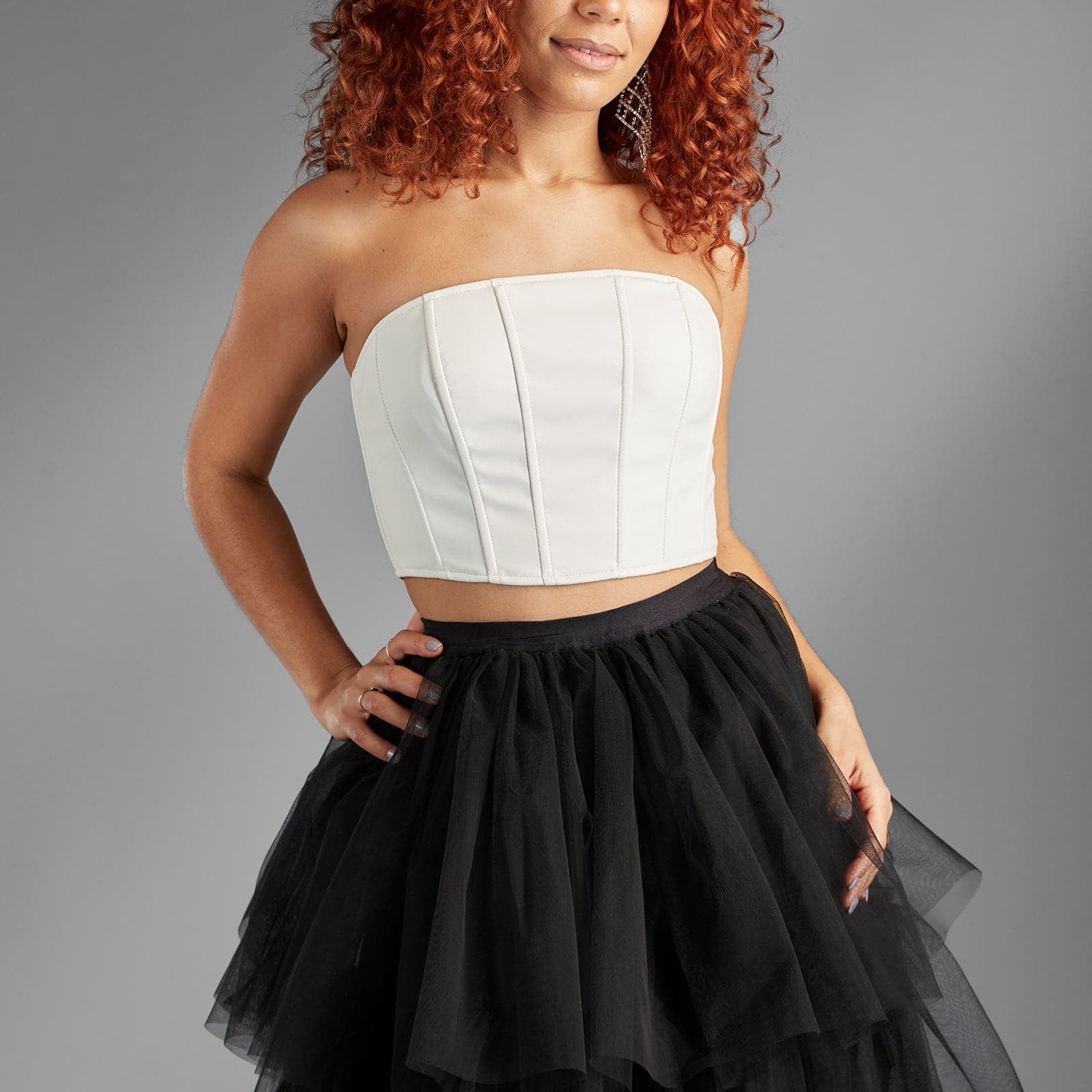 Versatile and trendy, this corset style top will be your go-to all season. Our White Sands is a form-fitting tube top with boning, is made of soft vegan leather material with a slight stretch and has a back zipper. Pair it with a fun and flirty skirt or your favorite pair of jeans. However you choose, it’s a statement style you’ll love to wear again and again - Avah Couture