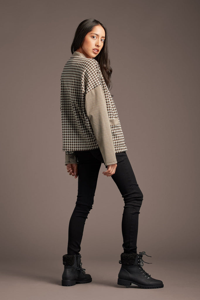 Show off your laid back style in our Lou Lou for You cardigan. The Houndstooth pattern and open front are the perfect combo for a stylish cardigan. Made of soft, poly spandex blend lightweight fabric, it features an open front and two front pockets. A collarless cardigan is also perfect for layering over any outfit. We love it with a crew neck tee shirt or tank, black jeans & boots for the perfect weekend look! Avah Couture