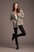 Show off your laid back style in our Lou Lou for You cardigan. The Houndstooth pattern and open front are the perfect combo for a stylish cardigan. Made of soft, poly spandex blend lightweight fabric, it features an open front and two front pockets. A collarless cardigan is also perfect for layering over any outfit. We love it with a crew neck tee shirt or tank, black jeans & boots for the perfect weekend look! Avah Couture