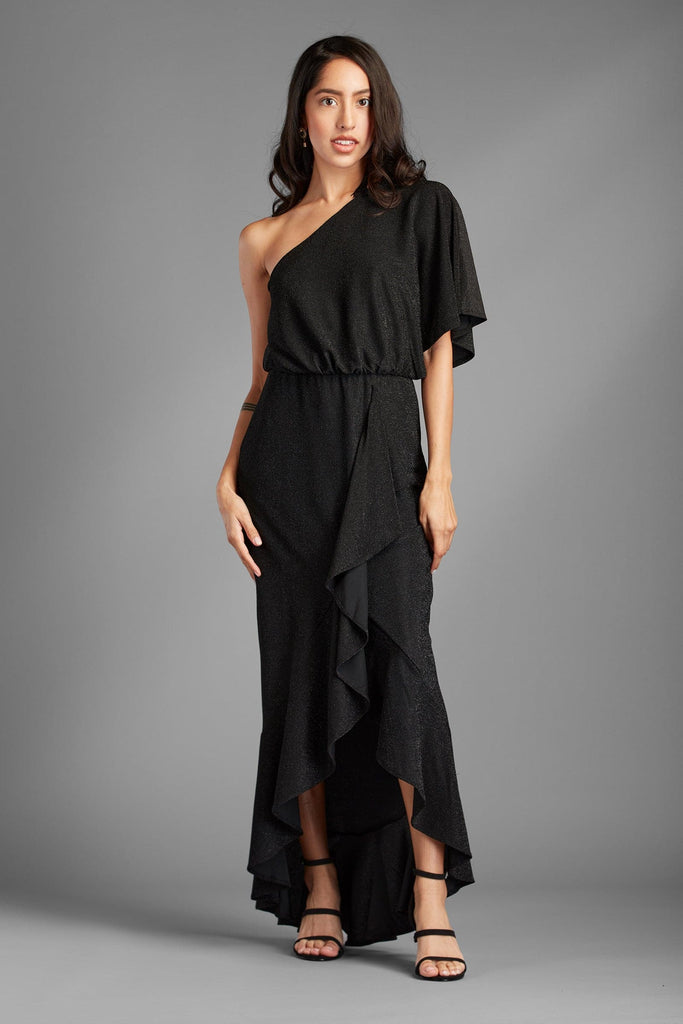 This dress will surely be a hit for the girl who wants to steal the night. The black onyx dress with lurex fabric gives this dress an unforgettable style with metallic shimmer. It has one shoulder, a flirty ruffle waist design, and a hi-low length for the ultimate sexy elegance. It is lined with a mini skirt underneath, so it has the perfect silhouette - Avah Couture
