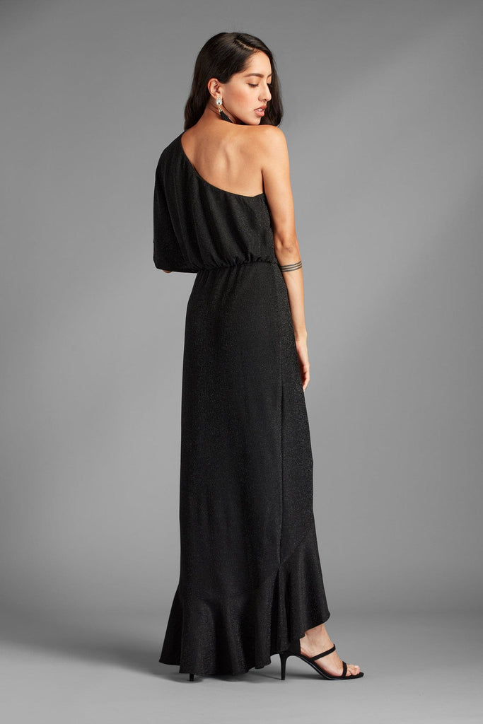 This dress will surely be a hit for the girl who wants to steal the night. The black onyx dress with lurex fabric gives this dress an unforgettable style with metallic shimmer. It has one shoulder, a flirty ruffle waist design, and a hi-low length for the ultimate sexy elegance. It is lined with a mini skirt underneath, so it has the perfect silhouette - Avah Couture