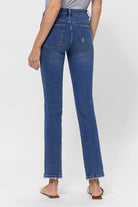 A classic button up jean with a comfortable stretch denim fabric. This mid rise straight leg jean features a versatile cut and elongated hem to create a sleek silhouette with plenty of coverage. A flattering wash that makes it great for pairing with heels or sneakers, this is a must have piece for your wardrobe. Avah Couture