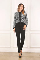 A classic piece that has timeless style, the Black And White Check Jacket is a must have this season. The heavy weight knit fabric features a black and white check pattern that gives it its name. A perfect balance of comfort and style, this jacket features 4 front snap buttons and 2 functional pockets. Wear it with your favorite outfit to work or play a classic piece to get you through any occasion! Avah Couture