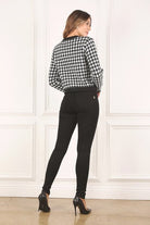 A classic piece that has timeless style, the Black And White Check Jacket is a must have this season. The heavy weight knit fabric features a black and white check pattern that gives it its name. A perfect balance of comfort and style, this jacket features 4 front snap buttons and 2 functional pockets. Wear it with your favorite outfit to work or play a classic piece to get you through any occasion! Avah Couture