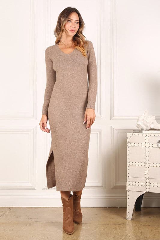 This long sleeved sweater dress comes in a comfy, soft and cozy fabric. The style features a v-neck with trendy melange pattern, perfect for the fall season. It is great for casual wear and looks beautiful paired with booties or knee high boots! Avah Couture