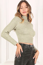 A cozy, long sleeve sweater for the stylish girl. Perfect for everyday casual wear, this cropped sweater will quickly become your go to. Featuring raglan sleeves and a mock neck, it’s sure to keep you warm while looking stylish. The perfect casual garment for all your cute outfits!