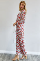 Side view of red  print long duster styled with heels and white tank – AVAH