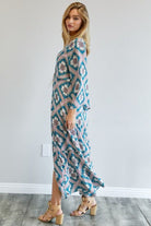 Side profile of teal kimono duster highlighting wide sleeve and soft drape – AVAH