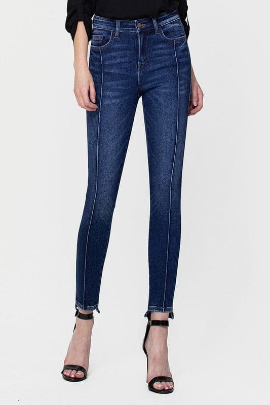 These jeans are cut from comfy stretch denim to sit on your hips and have a high rise that creates a smooth, sculpted shape. We love the ankle skinny fit and uneven hem, perfect to show off your favorite pair of shoes! Avah Couture