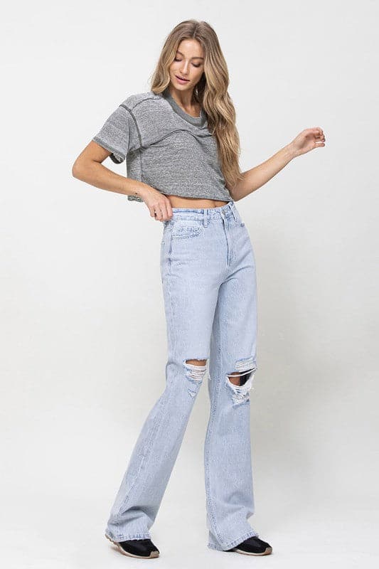 Get all the 90s vibes with these flare jeans. They are a super high-waisted, distressed and relaxed fit jean with a rigid denim texture for that authentic vintage look. Wear them with a chunky knit and platforms or cute crop top and sandals. However you style them, they will soon become your favorite pair of jeans! - Avah Couture