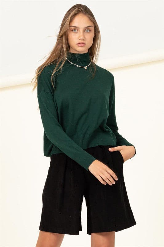 Keep it cozy with this sweater. Designed with a slouchy high neckline, sleeves with drop shoulders and a ribbed hem, you can style this versatile piece with anything. The relaxed, wide cut bodice ensures that you will be comfortable all day long!