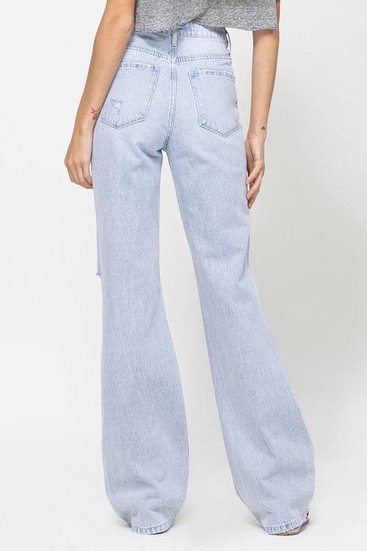 Get all the 90s vibes with these flare jeans. They are a super high-waisted, distressed and relaxed fit jean with a rigid denim texture for that authentic vintage look. Wear them with a chunky knit and platforms or cute crop top and sandals. However you style them, they will soon become your favorite pair of jeans! - Avah Couture