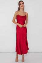 Take the plunge in this stunning dress that is sure to make a statement. This satin side slit midi dress has draped cami detailing and a fitted silhouette, accented with a side slit and small cowl front. This slip dress is sure to take your style to the next level. Pair it with red heels for a striking look - Avah Couture