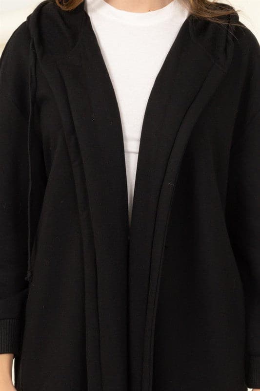 Elevate your look with this trendy terry coat! Featuring a hooded neckline, drop shoulders and relaxed long sleeves with fitted cuffs. The longline silhouette flatters your figure by emphasizing a tall silhouette and drawing attention to the length. The open front design makes it easy to wear over everyday outfits for added warmth without sacrificing style. Avah Couture