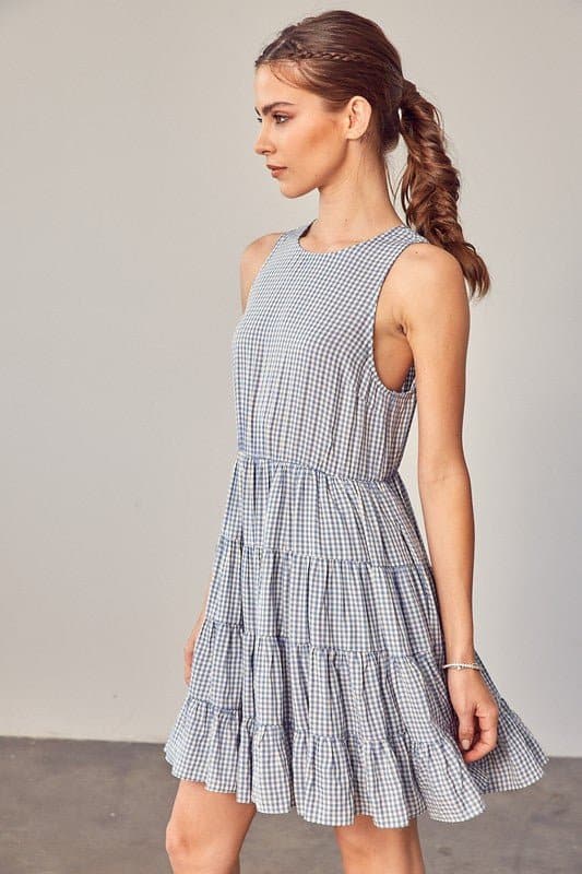 Sweet Things Gingham Tiered Mini Dress - Avah Couture-Adorable little tiered Gingham dress for some on-trend spring and summer fun. This mini dress is the perfect casual dress for all you sweet summer days. Sweet Things Gingham Tiered Mini Dress is sleeveless, has a jewel neckline and keyhole back with tie. Self: 70% Polyester, 30% Rayon. Lining: 100% Rayon- Blue