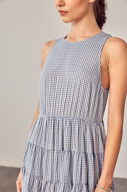 Sweet Things Gingham Tiered Mini Dress - Avah Couture-Adorable little tiered Gingham dress for some on-trend spring and summer fun. This mini dress is the perfect casual dress for all you sweet summer days. Sweet Things Gingham Tiered Mini Dress is sleeveless, has a jewel neckline and keyhole back with tie. Self: 70% Polyester, 30% Rayon. Lining: 100% Rayon- Blue