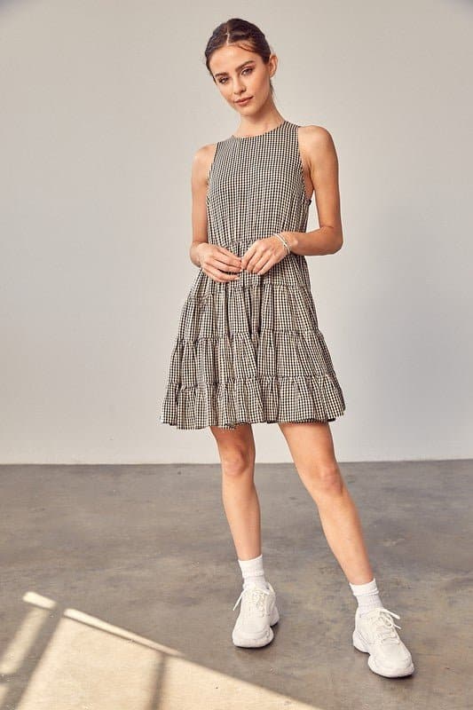 Sweet Things Gingham Tiered Mini Dress - Avah Couture-Adorable little tiered Gingham dress for some on-trend spring and summer fun. This mini dress is the perfect casual dress for all you sweet summer days. Sweet Things Gingham Tiered Mini Dress is sleeveless, has a jewel neckline and keyhole back with tie. Self: 70% Polyester, 30% Rayon. Lining: 100% Rayon- Black